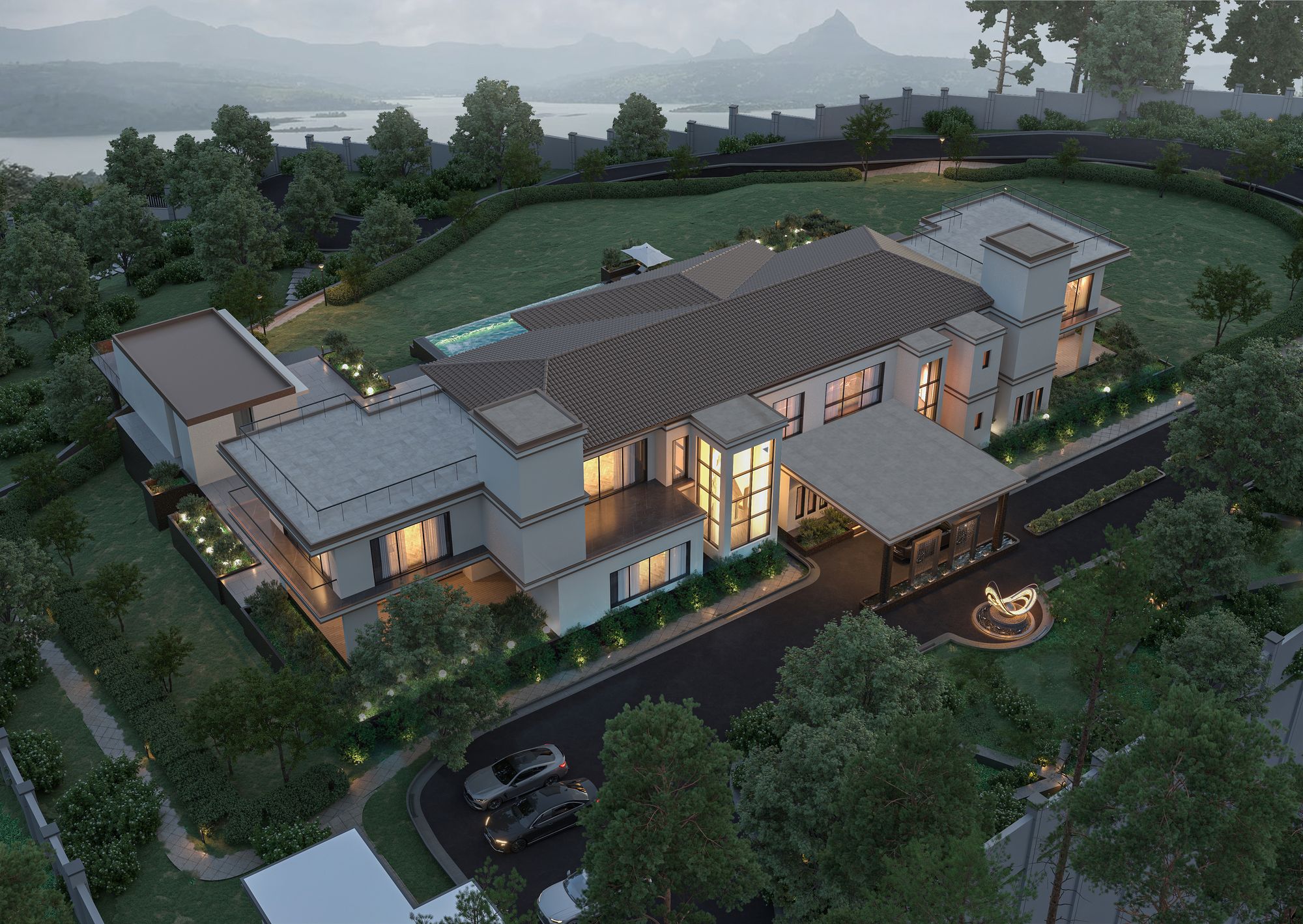 Aerial dusk view of a hillside villa with pool, terraces and lake backdrop